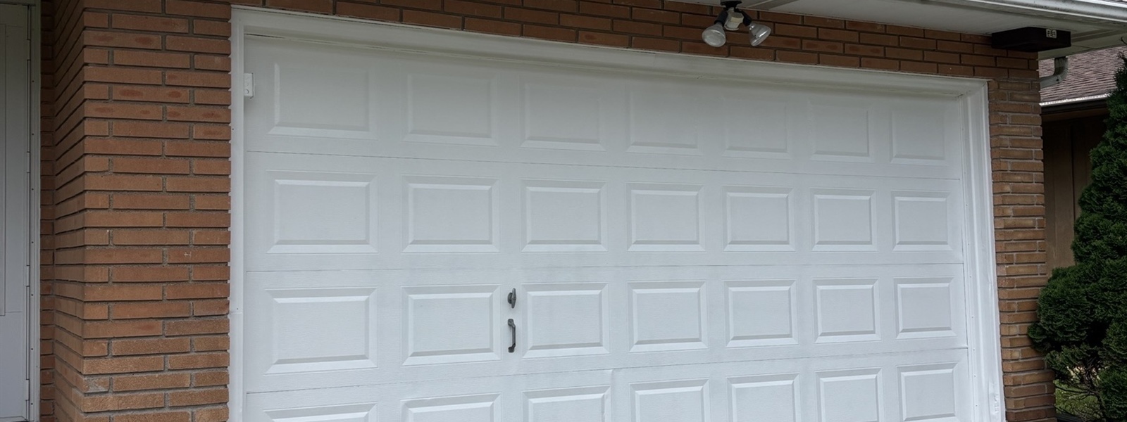 Rusty Garage Door Refinishing Before a Home Sale in Crystal, MN