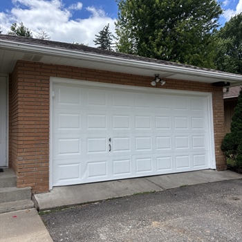 Rusty Garage Door Refinishing Before a Home Sale in Crystal, MN