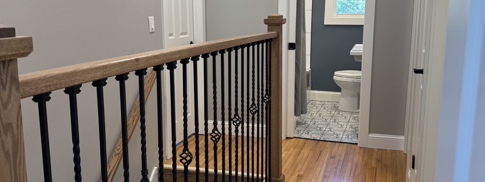 Custom Oak Staircase & Railing Remodel in Minnetonka, MN