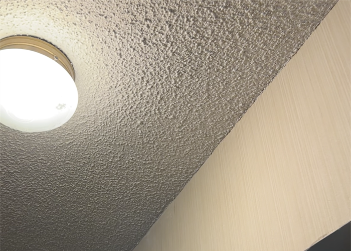 Finished popcorn ceiling patch blended with the existing ceiling texture