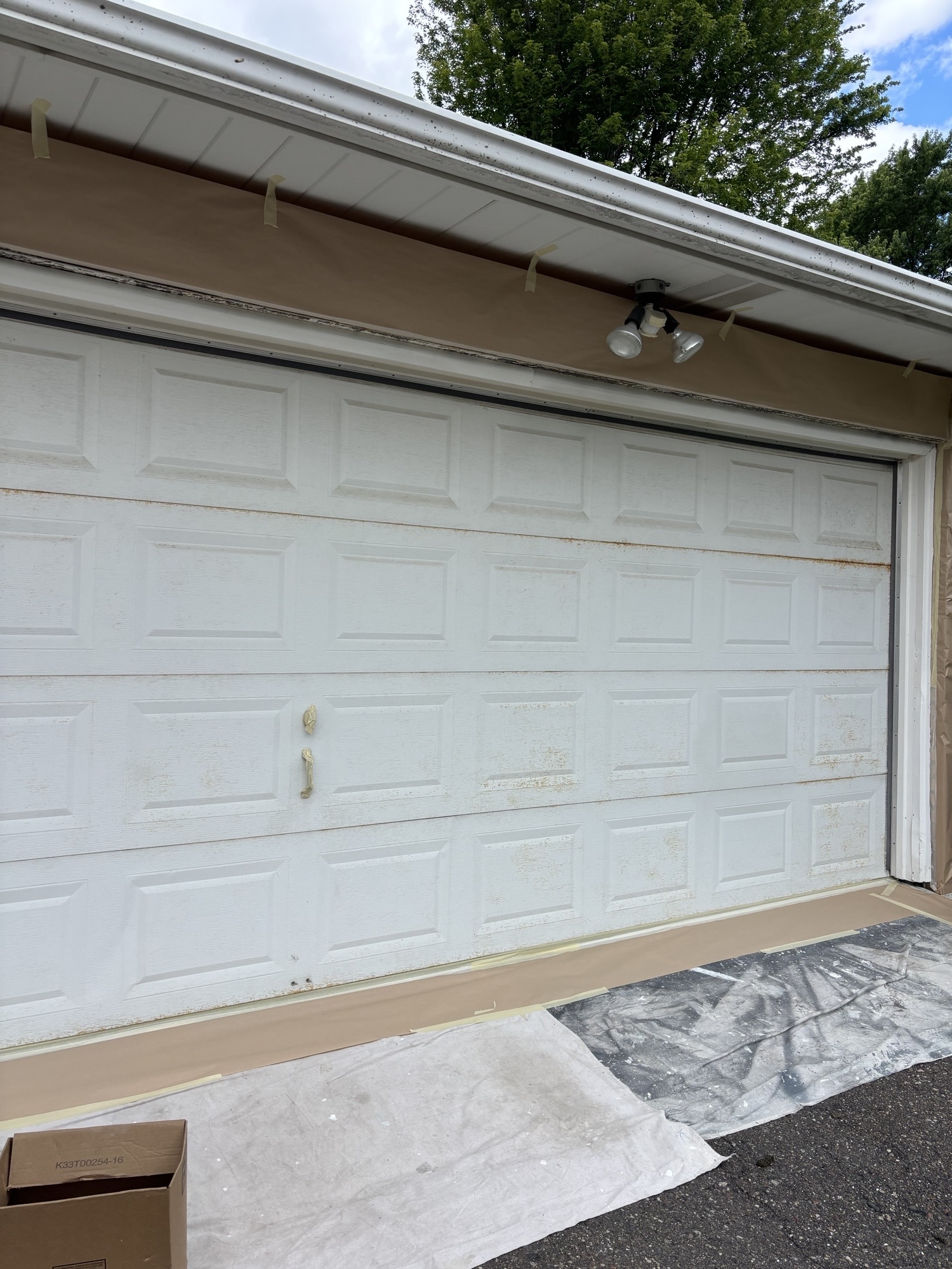 Rusty Garage Door Refinishing Before a Home Sale in Crystal, MN