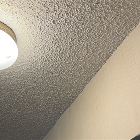 Finished popcorn ceiling patch blended with the existing ceiling texture