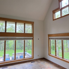 Freshly painted vaulted living room with large windows after popcorn ceiling removal in a Lake Elmo home