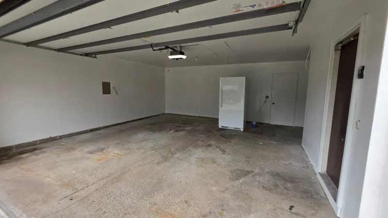 Apple Valley garage with smooth, fully painted walls and ceiling after drywall repair