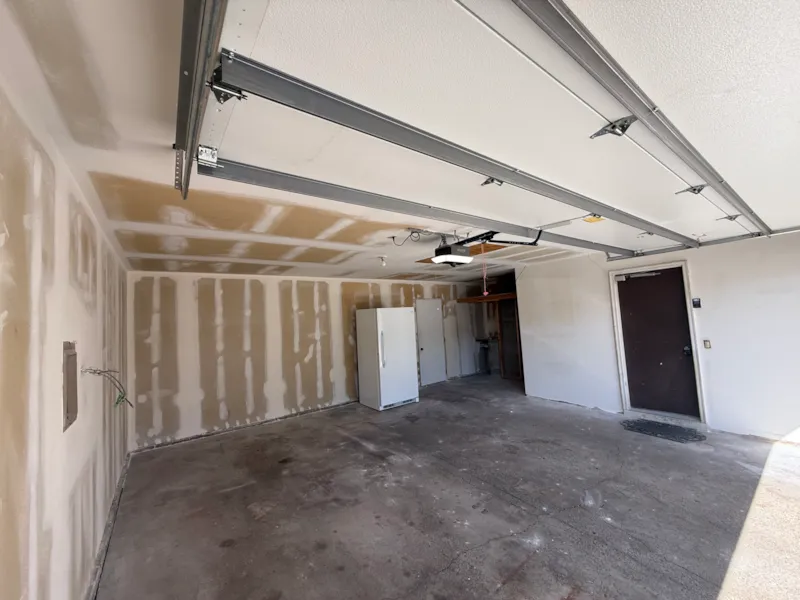 Apple Valley garage back wall with taped and mudded drywall seams before painting
