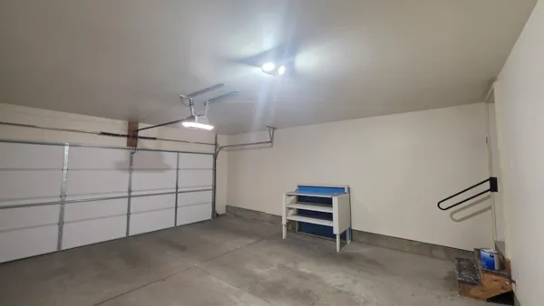 Painted garage ceiling and walls in an Eagan townhouse after drywall repair