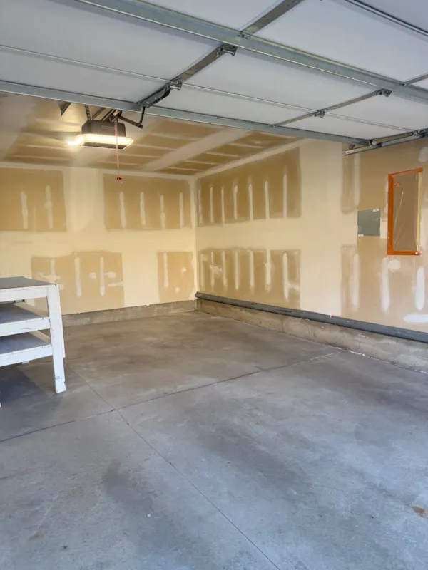 Mudded garage ceiling and wall seams in an Eagan townhouse before sanding and paint