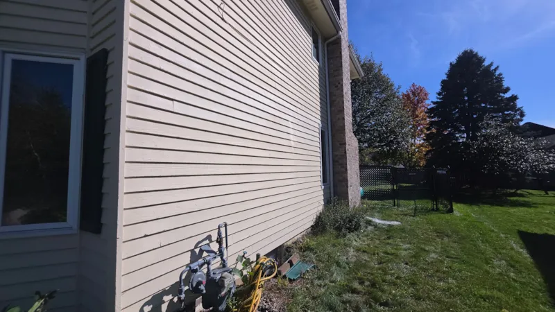 Burnsville side wall with siding repairs painted and blended into the existing color
